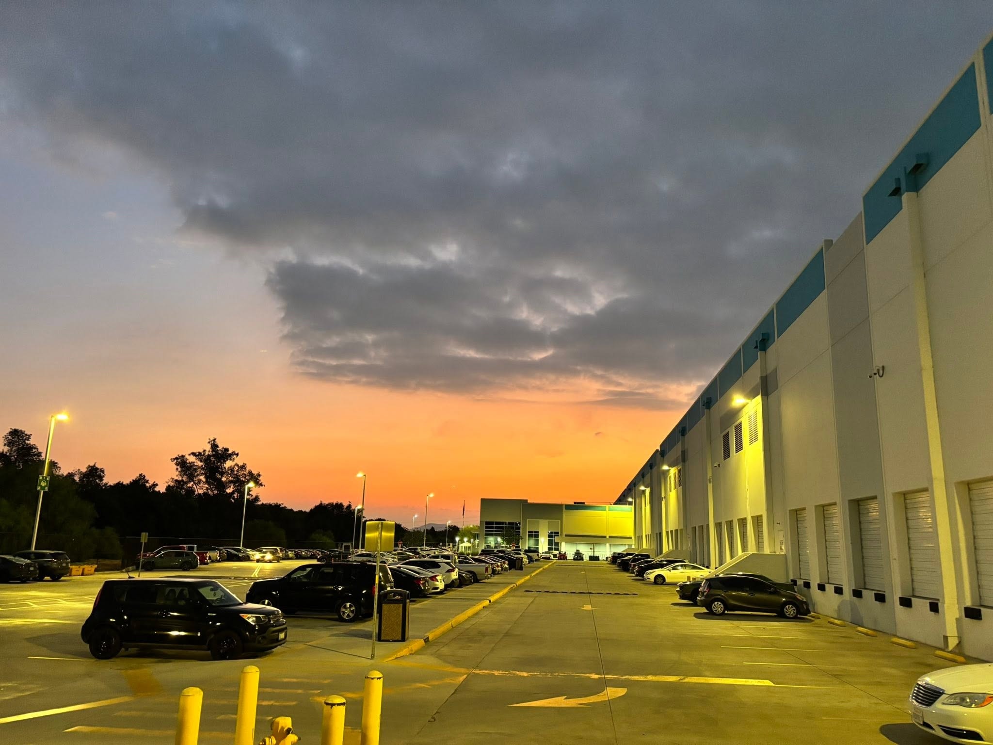 Warehouse parking lot at sunset
